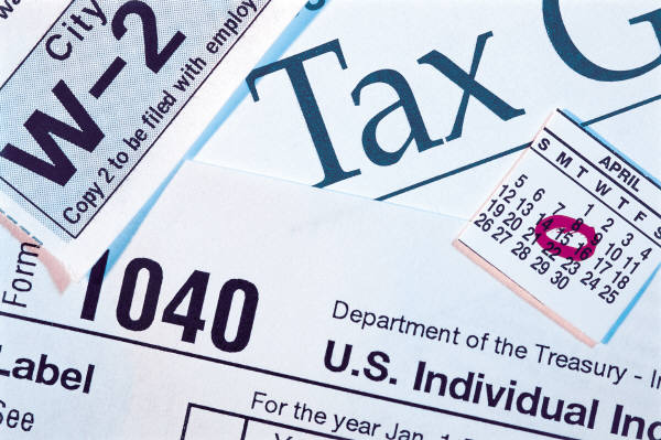 Image of overlapping tax forms. 